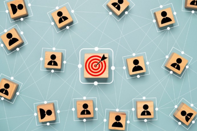 Red dartboard and black arrow connection linkage with human icon for customer focus target group