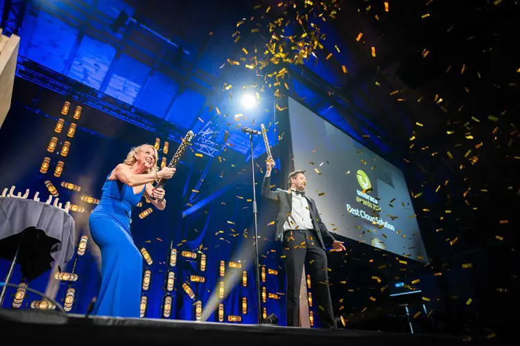 Photo of a woman releasing confetti at a previous Codegarden