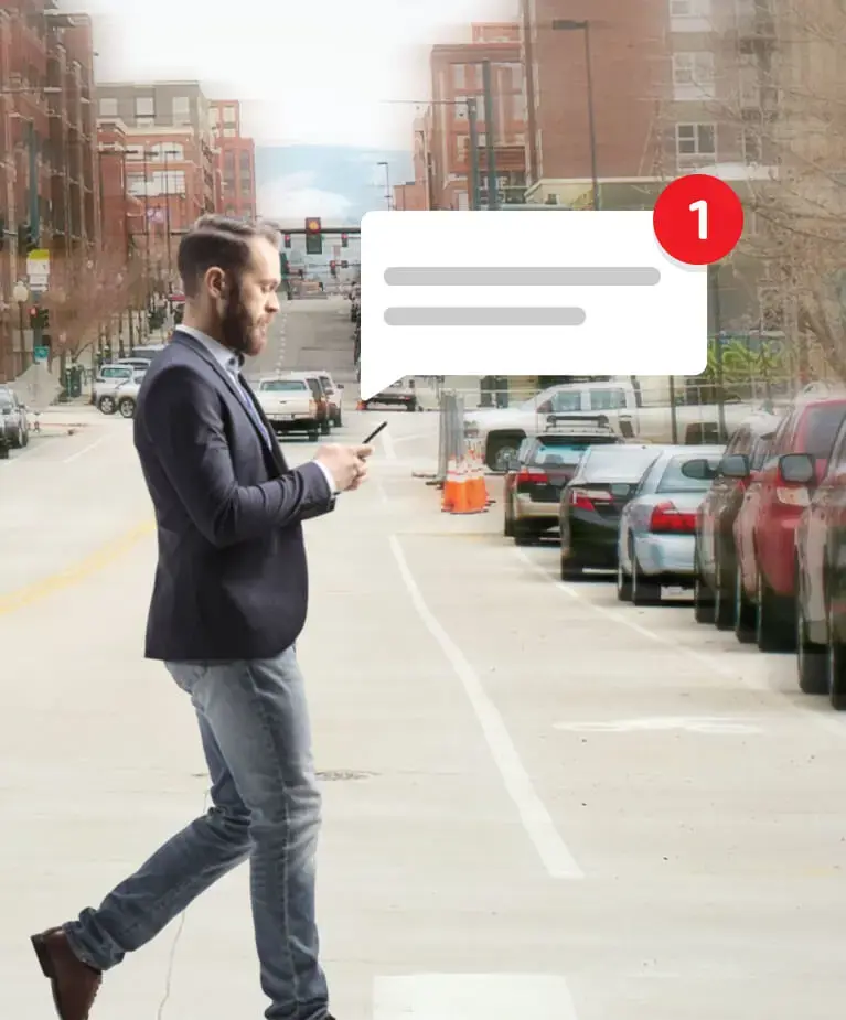 Man walking in the street with a notification over his head