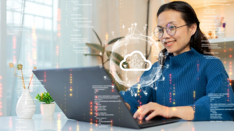 Woman uploading and transferring data from computer to cloud computing.