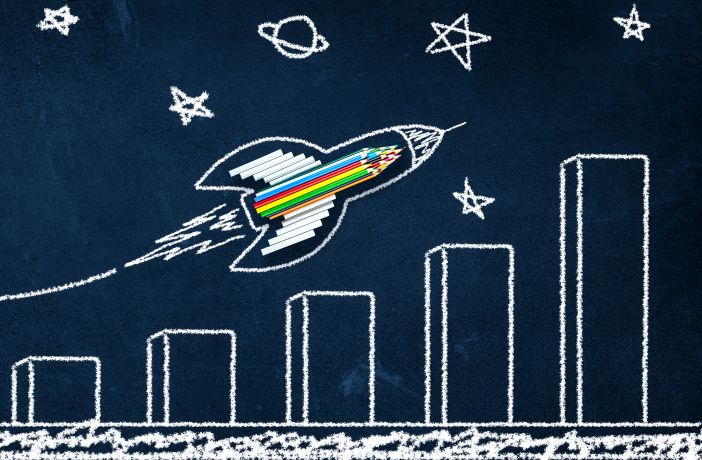 Rocket Made From Pencils And Chalk With Growth Chart Drawing On Chalkboard Background